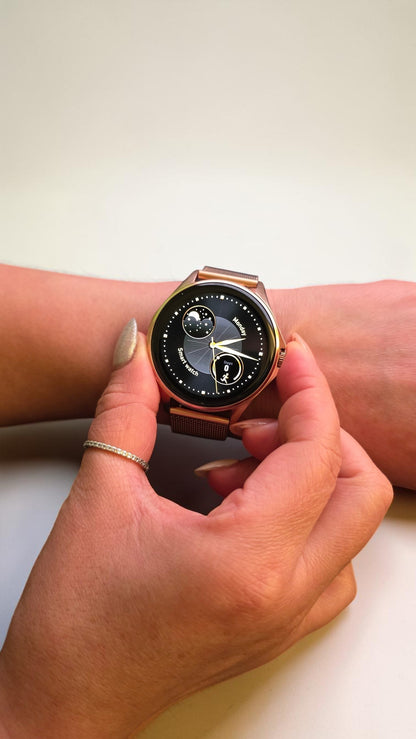 Reloj inteligente Raftec en oro rosa con pantalla circular y correa de malla metálica elegante en la muñeca