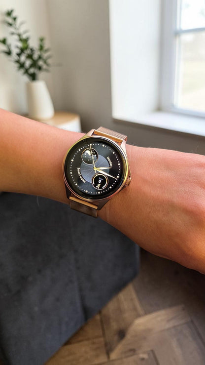 Reloj inteligente Raftec en oro rosa con pantalla circular y correa de malla metálica elegante en la muñeca